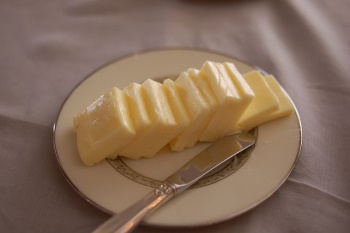 A butter knife with some butter